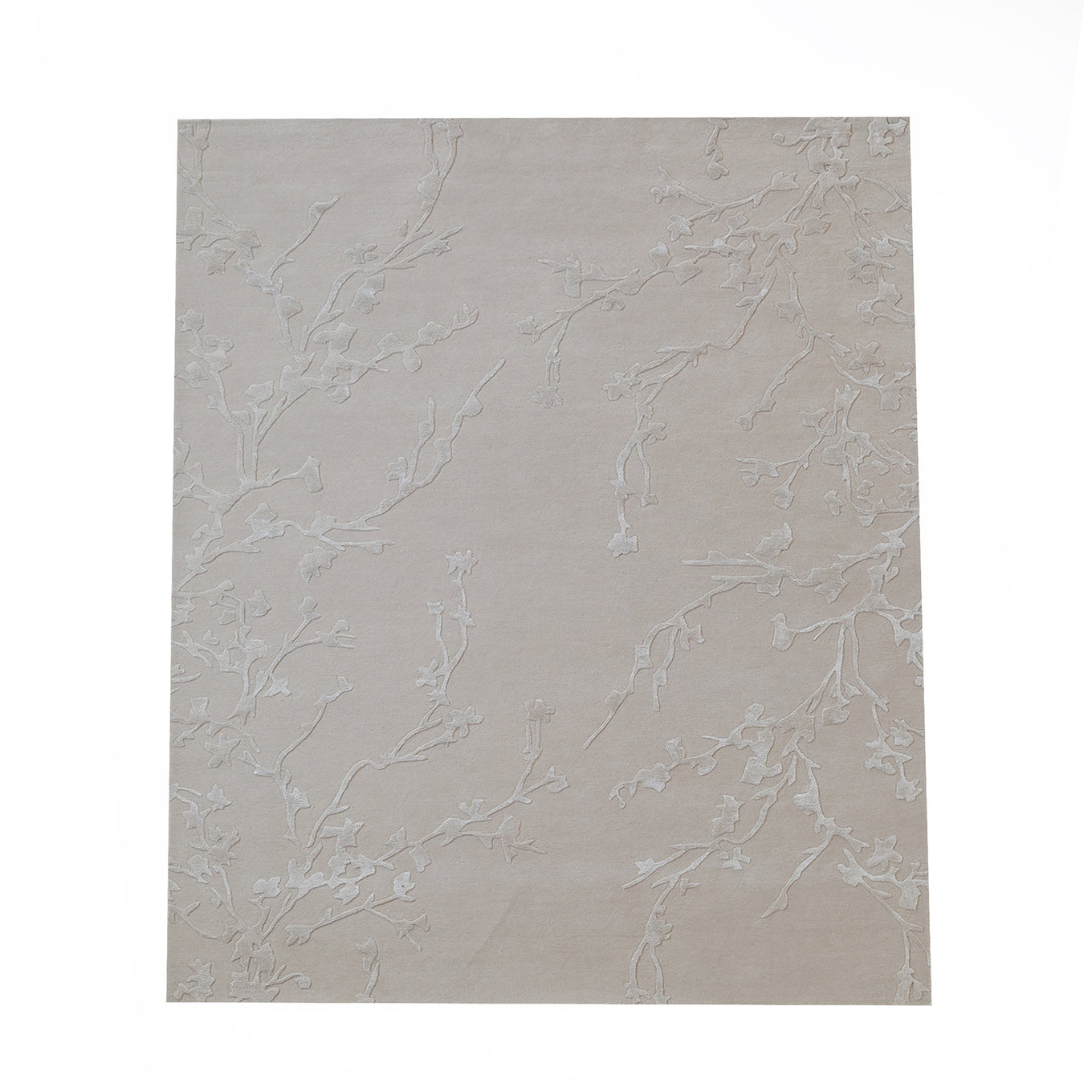 The Handmade beige Color Decor Rug- HTWV 115 by RAMSHA HOME features a subtle, textured branch pattern in a rectangular shape, shown isolated on a white background.