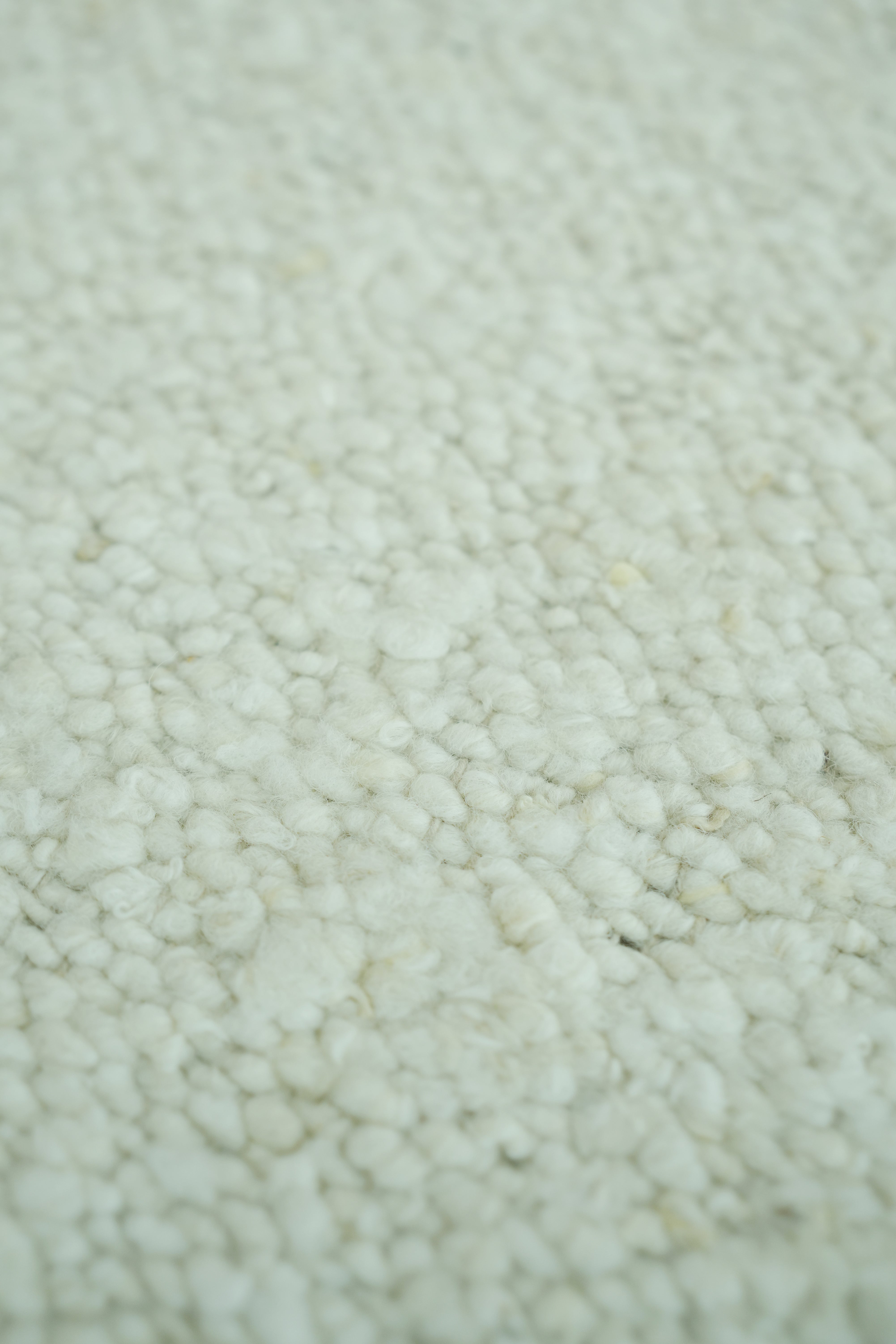 Close-up of the RAMSHA HOME Handmade Natural Off White Woven Rug for Home Decor SR-059, featuring soft, tightly woven loops for a plush and cozy texture.