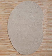 The RAMSHA HOME Premium Off-White Area Carpet - HTW 115 (200x300 cm), hand-tufted with a raised leaf pattern, enhances the look of a light brown wooden floor.