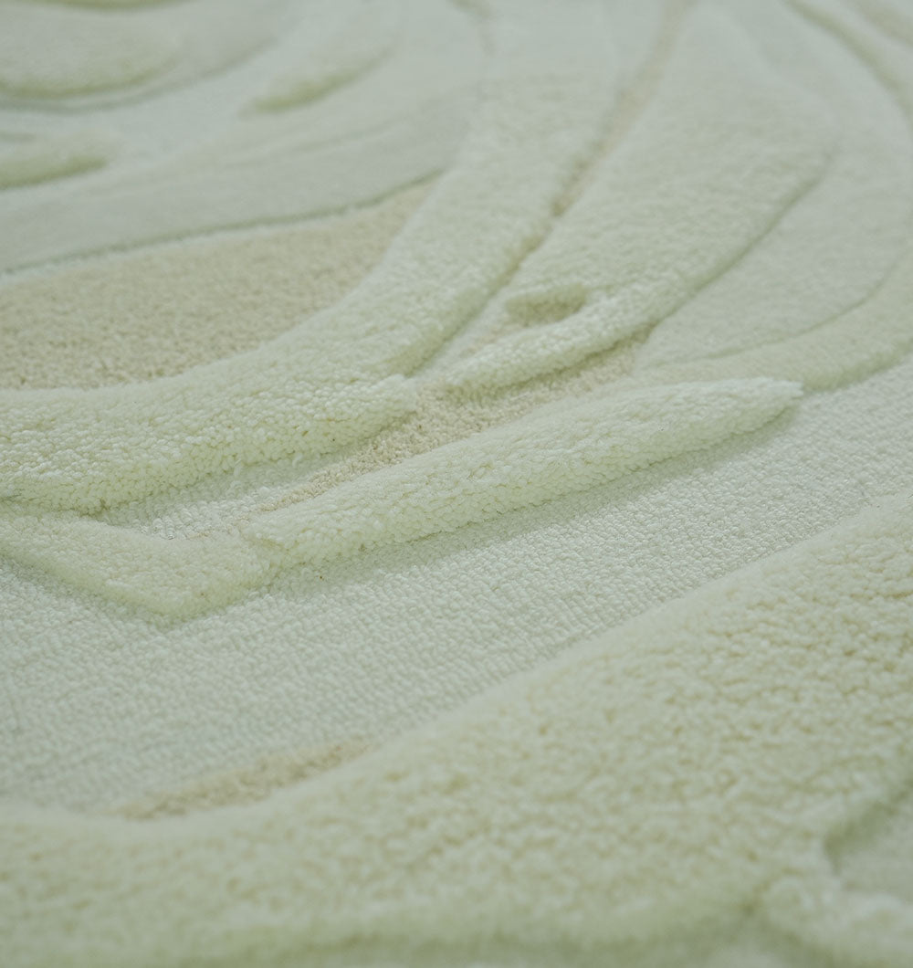Close-up of the RAMSHA HOME Beige Color Oval Shaped Handmade Rug - HTWV 106 (200x300cm), showing its wavy, raised patterns and plush texture—curved lines and subtle tones make it ideal for a neutral, modern décor.