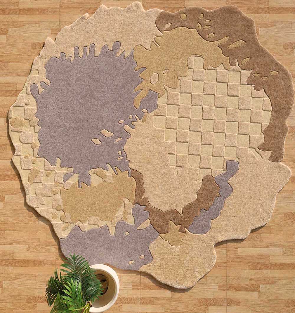The RAMSHA HOME Abstract Shaped Handmade Area Rug- HTWV 174 (200x300 cm) features irregular beige, brown, and gray shapes on a wood floor, with a small potted plant with green leaves partly placed on the modern rug.