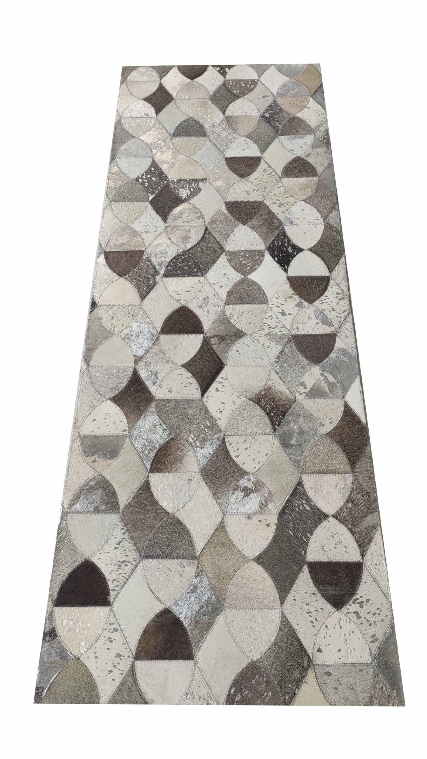 The Delightful Modern Grey Color Leather Rug - LR 008 by RAMSHA HOME features a geometric patchwork of circles and diamonds in gray, beige, and brown tones with a textured look.