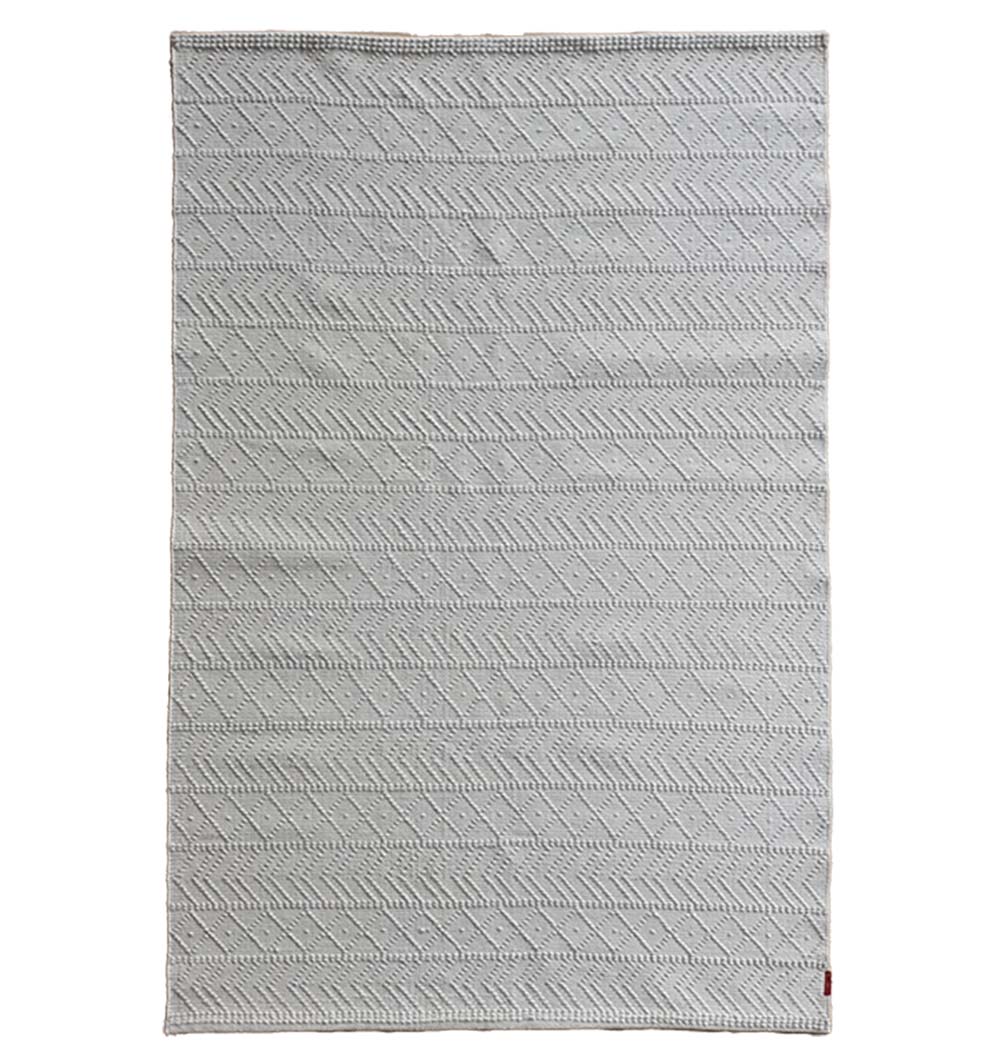 The RAMSHA HOME White Rectangle Woven Area Rug SR-022 features a light grey hue, subtle diagonal stripes, textured lines, durable polyester construction, modern design, and a small red tag in one corner. Ideal for living rooms and bedrooms.