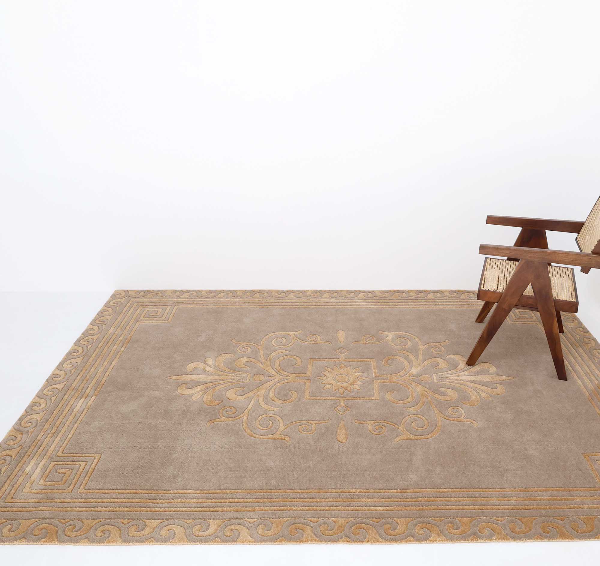A woven wooden chair is placed on a RAMSHA HOME Beige Rectangle Novara Rug (CMN 22, 200x300cm), which features an ornate, symmetrical pattern with a geometric border, all set against a plain white background.